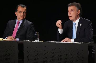 Óscar Iván Zuluaga, links, gewann die erste Runde der Präsidentschaftswahlen, gegen den aktuellen Präsidenten Juan Manuel Santos